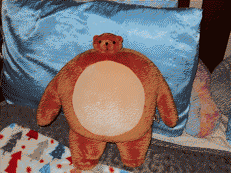 A bear plushie with a big body and a tiny head