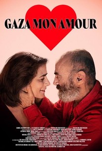 The movie poster for 'Gaza mon amour,' featuring an old, bald, middle-Eastern man with a patchy white beard smiles and lovingly cups his hands around the face of a smiling, middle-aged woman with dark bobbed hair.