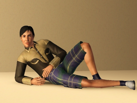 A devastatingly handsome man in a brown cowboy shirt and plaid khaki shorts.